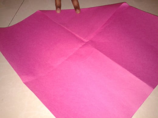 Fold the corner of a square shape to the center