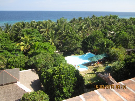 The view of the pool and further on, the private beach of Amarela Resort.