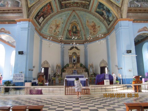 Dauis Church, where the ceiling was painted by Ray Francia, who also did the Gaviola house ceiling and frescos.