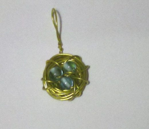 yellow wire with blue beads