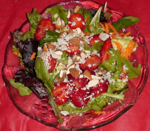 Spinach and baby greens with strawberries, almonds, and blue cheese. There are endless variations to this salad!