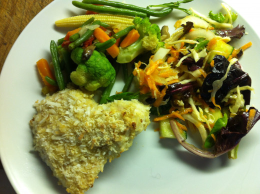 Coconut chicken breasts with stir fry and a salad