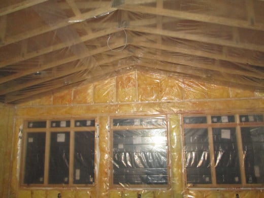 Properly installing vapor barriers for conventional fiberglass insulation can dramatically increase the energy efficiency of a building.
