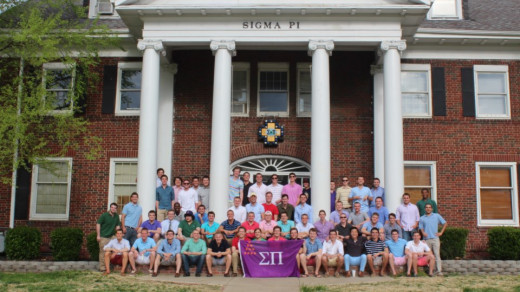 A group of Sigma Pi's in front of their house.