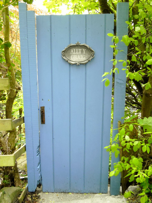 The door which leads to a quaint dwelling from yesteryear.The translaed meand 'The Cliff Faced Forest.'