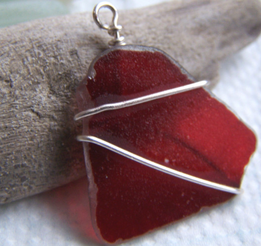 Learninig Wire Work Techniques: A Simple Wire Wrap of Red Sea Glass - one of my first attempts.