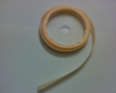 a string or roll of ribbon of any color