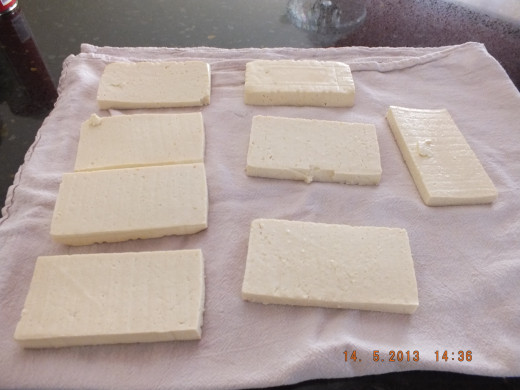 Slice the tofu and lay it on a clean tea towel