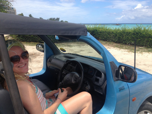 Ash in the driving seat of the beach-buggy style rental car we took for a couple of days