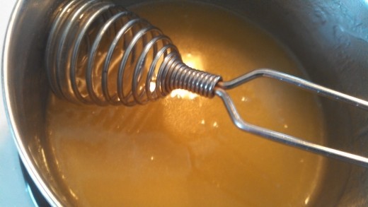 Melt butter, corn syrup and sugar in small saucepan.  Remove from heat.