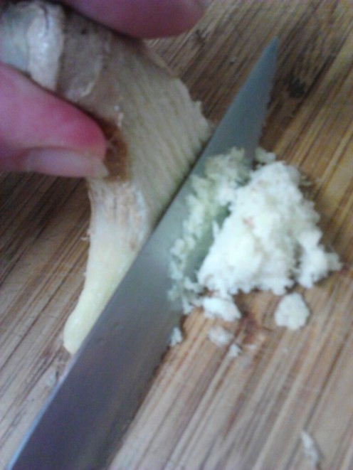 I do not even have to use a cheese grater for frozen Ginger Root. It becomes a nice fluffy pile of Ginger Powder when sliced with my favorite little kitchen knife.  
