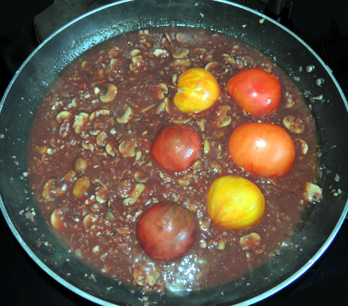 add tomatoes halves, face down