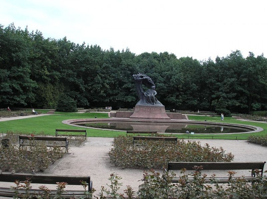 Chopin's bronze statue in the Lazienki (Royal Baths) park, erected in 1926 it was also destroyed by the Nazis, and rebuilt after the war.  Free Chopin recitals are performed at its base during summer afternoons.