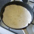 Heating a flour tortilla in a dry frying pan