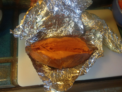 Slice open the yam after it has been on the grill for 45 minutes to an hour.