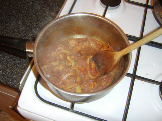 Leftover pork bhuna is gently simmered