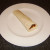 Bhuna spiced pork wrap is served