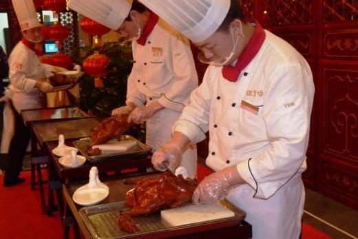 8 b) Chefs carving the Peking Ducks
