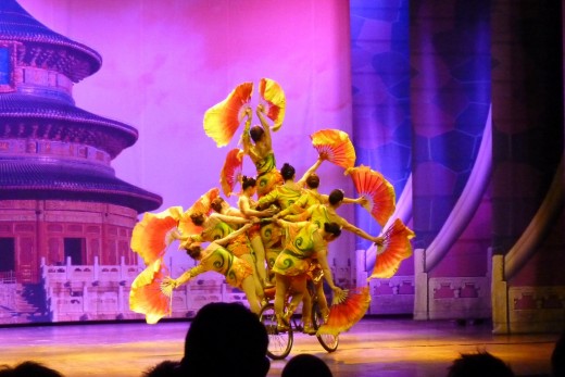 9 b) Nine Chinese ladies on one bicycle at the Chinese Acrobatic show