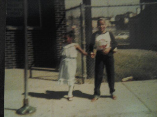 My little sister Keshia and I waiting of the CTA, bus, on 103rd street in Chgo.  I was 20, Keshia 9
