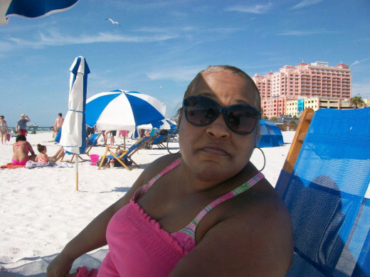I relaxing under a beach umbrella with a family friend at Clearwater Beach, Fl  May 2013