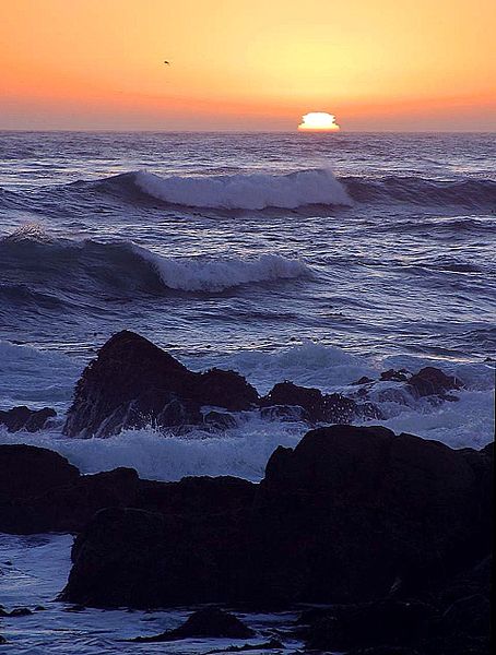 sunset over the ocean by Jon Sullivan