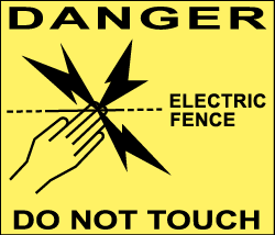 Danger sign board displayed along the fence