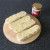 Dijon mustard is spread on halved subs