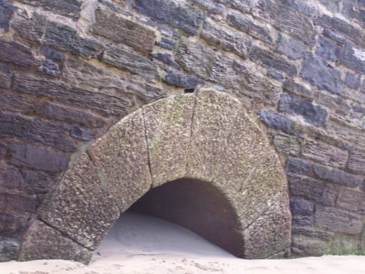 Newquay Beaches: Top of an old tunnel built for people to walk between Harbour Beach and Towan Beach - see how high the sand has become!