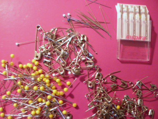 Pins, sewing needles, safety pins, and sewing machine needles are all sharp objects that can poke you and cause you to bleed on your quilt.