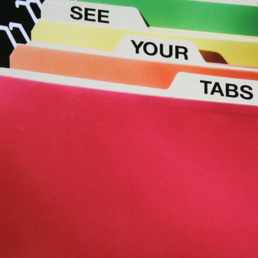 Color coded hanging files that hang lower to show your file folder headings
