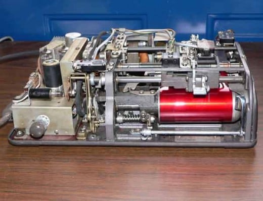 Insides of a dictaphone which used a dictabelt (red) 