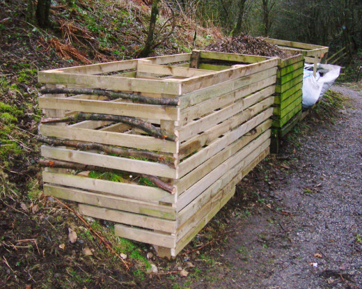 Compost bins created using slats of timber. 