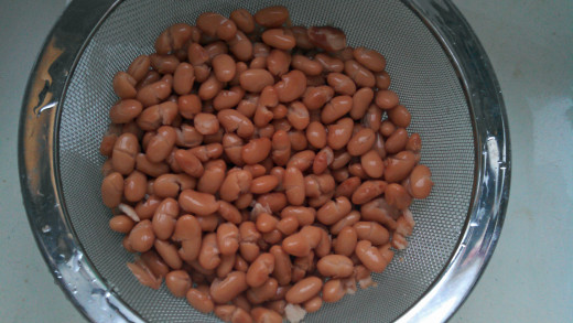 Drain and rinse two 15-ounce cans of pinto beans.  