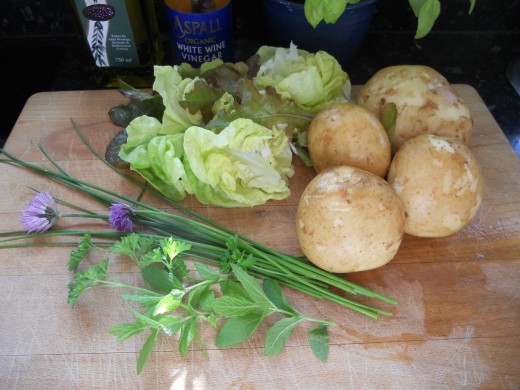 Home grown new potatoes, lettuce and herbs - just right for a potato salad