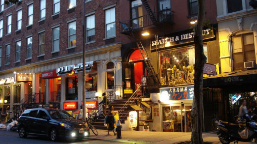 The stranger & Mary left the bar/restaurant, walking towards St. Mark's Place, making small conversation.  Mary was in a rush to get home while the stranger wanted to take in a midnight movie.