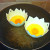 Put eggs into poachers and poachers into the pan Put eggs into poachers and poachers into the pan