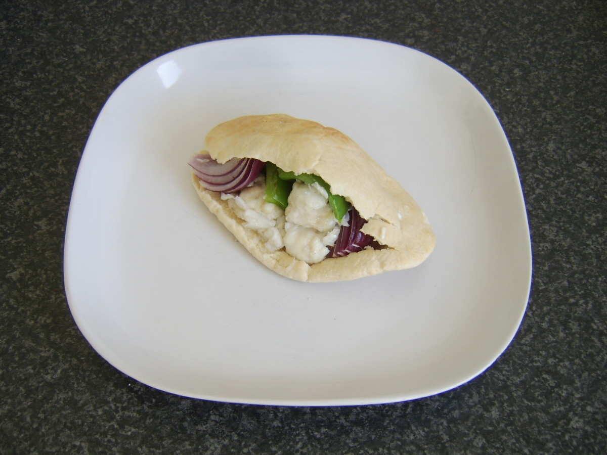 Ling, green pepper and red onion shish kebab served in a pitta bread pocket