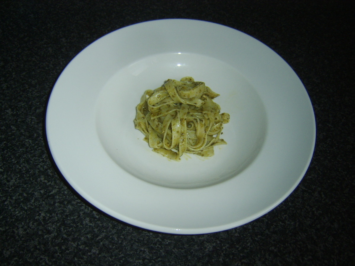 Linguine with drained pesto sauce is plated