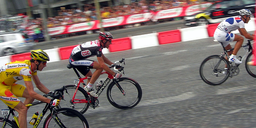 Riders in a breakaway on the streets of Paris. Winning a Tour de France stage will net the rider 22,500 euros. 
