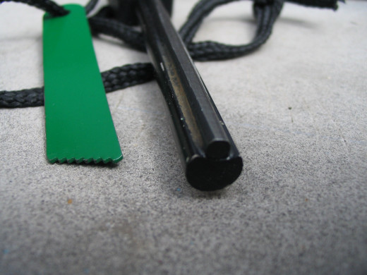 2 components fire-stone : a big magnesium rod + a smaller ferrocerium rod. The sparks lit the magnesium which lit the paper.