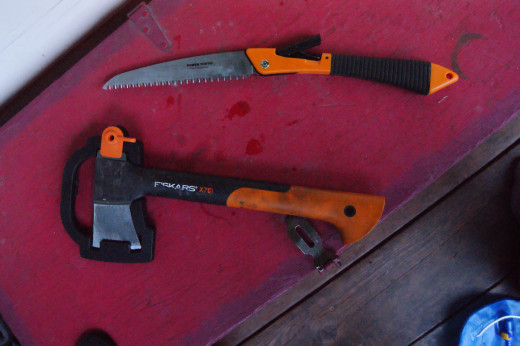 Fiskars axe with holder and Fiskars folding saw. 