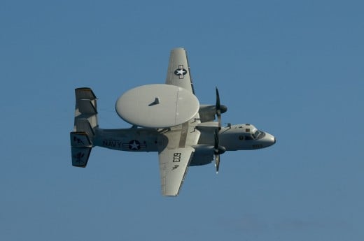 An E2-C Hawkeye.  This is not the same as I recall seeing as a child (the disk seemed a lot bigger), but it is close enough to explain the misunderstanding.