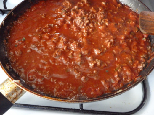 The meat and tomato sauce for the moussaka is flavoured with cinnamon and oregano.