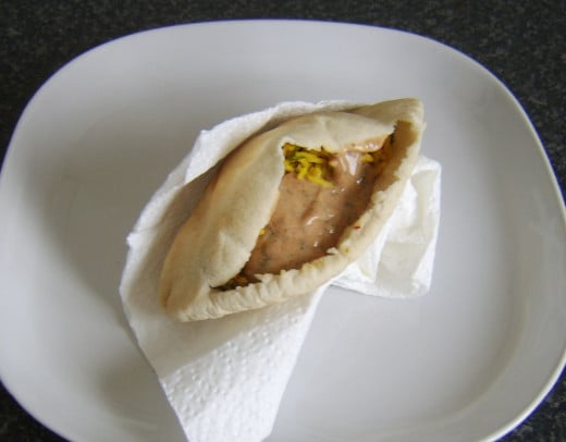 Pakora sauce is added to fragrant Indian rice pitta bread sandwich