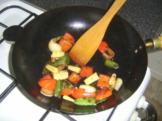 Light soy sauce is added to vegetables