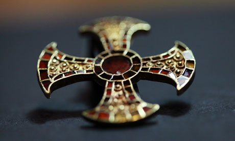 This cross of gold and garnet was found in a Anglo-Saxon girls grave, she was buried around 1,300 years ago