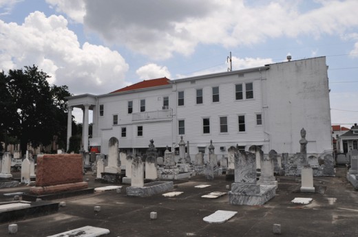 The building is huge, and a Jewish cemetery wraps around the building.
