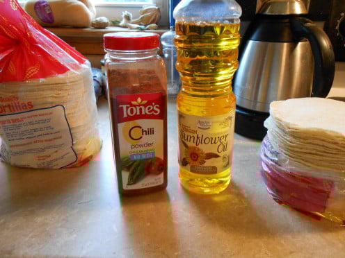 Cooking corn tortillas in vegetable oil flavored with chili powder makes the soft outer shell of cheese enchiladas.  White corn tortillas are my favorite for their mild flavor and soft texture.