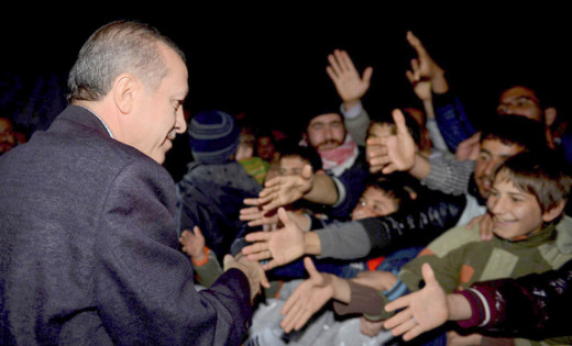 Turkish Prime Minister Tayyip Erdogan shakes hands with Syrian refugees as he visits a refugee camp near Akcakale border crossing on the Turkish-Syrian border, Dec. 30, 2012.